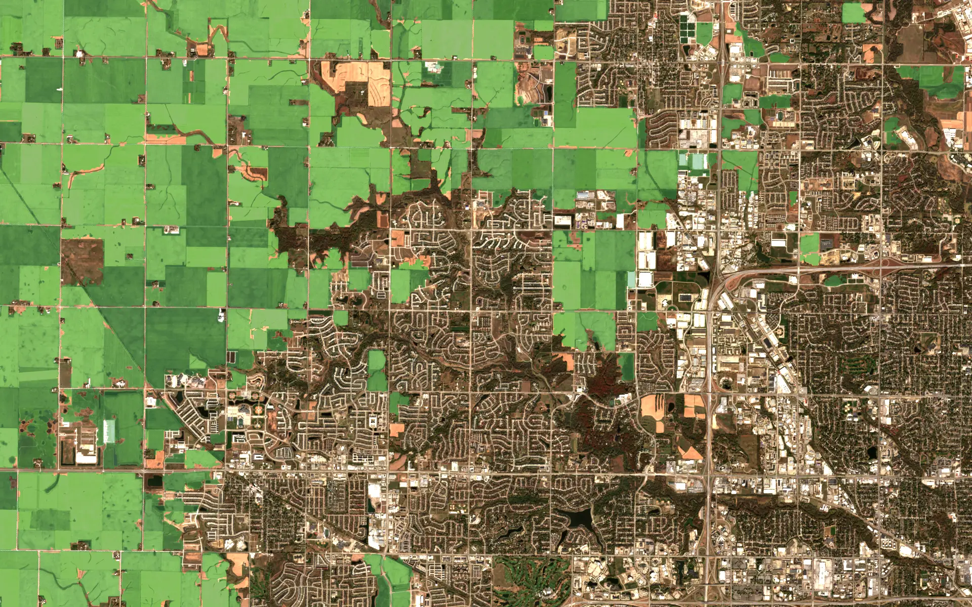 Sentinel-2 image of the farmland and suburbs west of Des Moines, Iowa, in October 2024, with every crop field picked out in green
